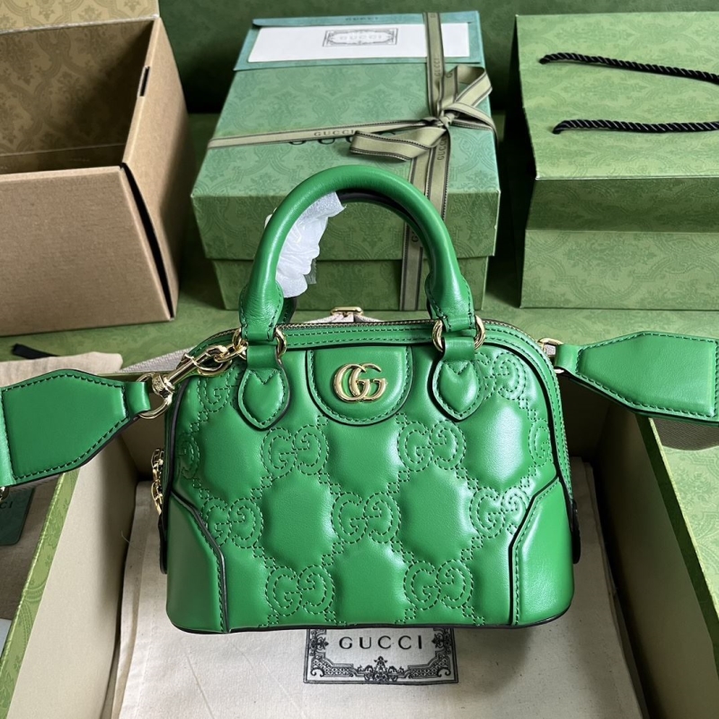 G*u*i top handle bags